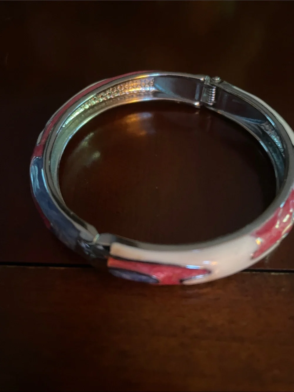 Gorgeous enamel and metal bracelet. Opens easily